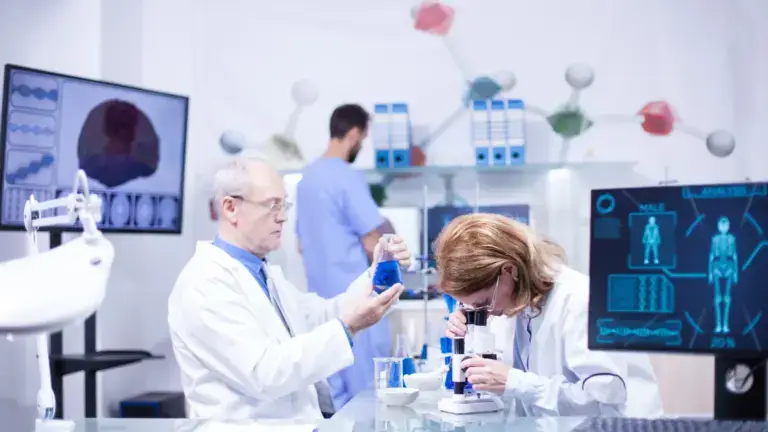 Researchers working in a modern medical laboratory